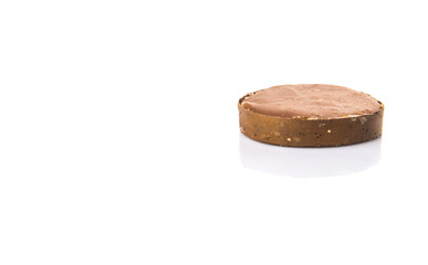 Round palm sugar over white background