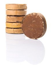 Round palm sugar over white background