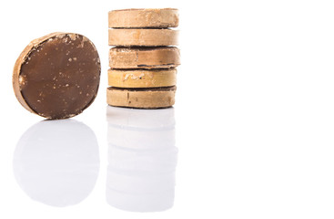 Round palm sugar over white background