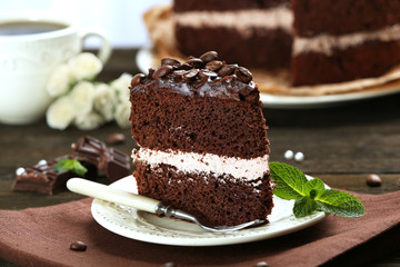 Delicious chocolate cake on table close-up