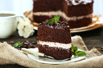 Delicious chocolate cake on table close-up