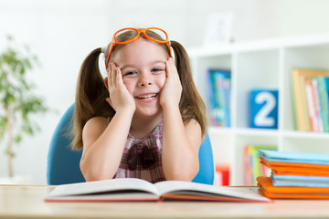 little girl reading a book
