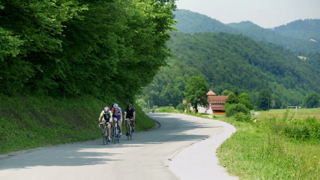 VRHNIKA, SLOVENIA - AUG 24, 2013: Shot of a couple of bicycle racers far ahead from the rest 