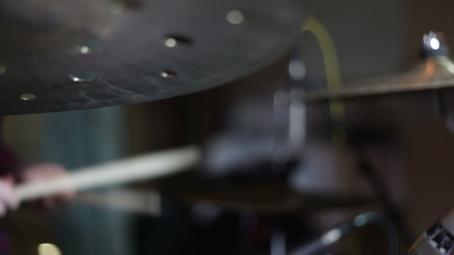 close up shot of musican playing drums