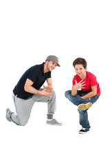 Two hip hop dancers isolated on white background.