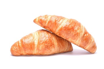 Two fresh croissant isolated on white background