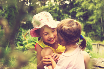 Toned Summer portrait of cute little girls