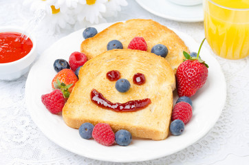 Breakfast with a smiling toast, fresh berries, berry jam