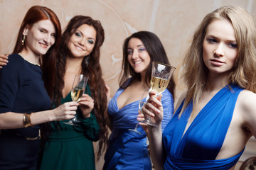 Portrait of cheerful girl with champagne