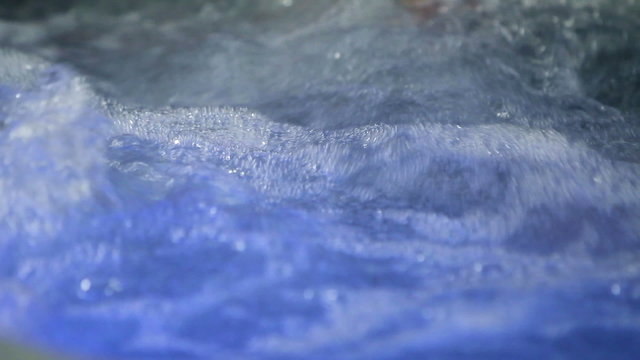 young couple relaxing in jacuzzi and  spending romatic time together 