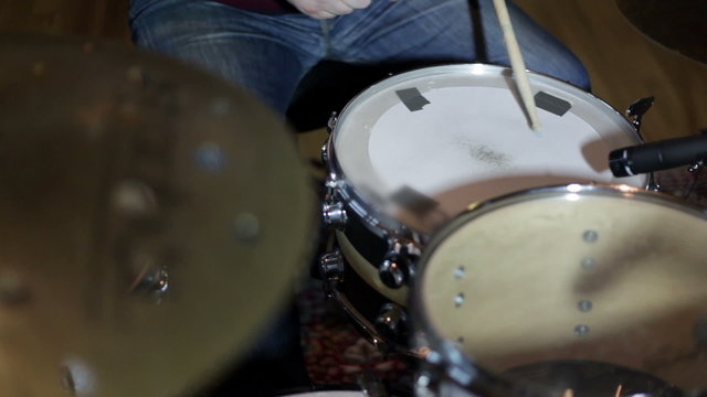 close up shot of musican playing drums