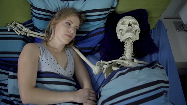 Girl laying with a dead man