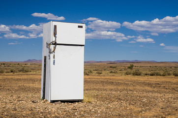 Abandoned refrigerator in desert