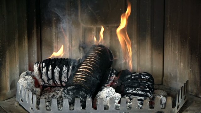 Burning logs and ashes