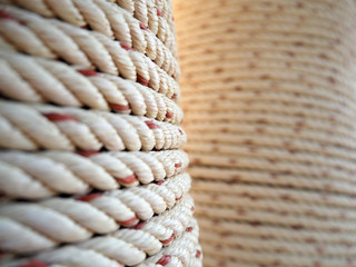 Thick rope wrapped around a pillar - 77447094