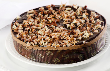 Whole Chocolate cake on  white plate