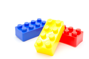 Fototapeta premium blocks Plastic building blocks on white