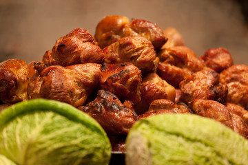 Fragrant fried meat and heads of cabbage of fresh cabbage