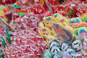 Fototapeta na wymiar Colorful sweets, candies and lollipops at street market