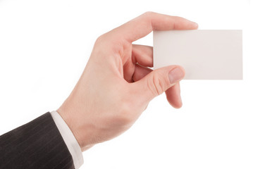 Businessman in suit holding a blank business card isolated