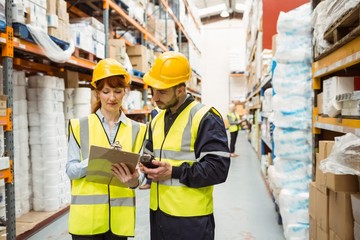 Warehouse manager talking with worker