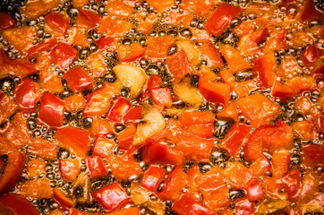 Roasting in butter slices of sweet pepper