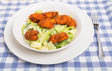 Caesar Salad in Bowl with Buffalo Tenders