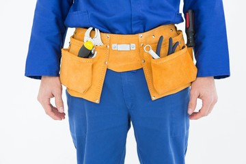 Fototapeta na wymiar Repairman wearing tool belt