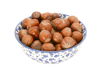 Hazelnuts in a blue and white china bowl