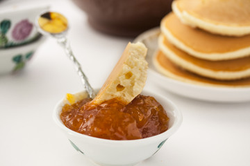 pancakes with delicious jam on white plate