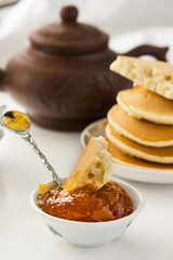 pancakes with delicious jam on white plate