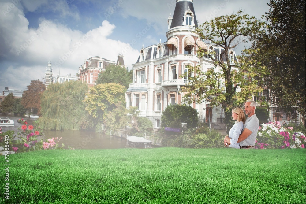 Poster Composite image of happy couple smiling and embracing