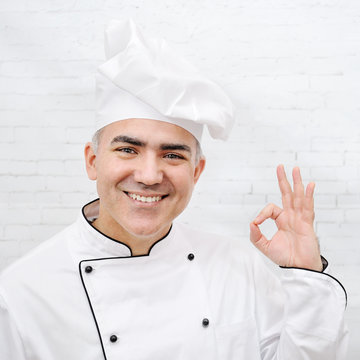 handsome chef dressed in white uniform
