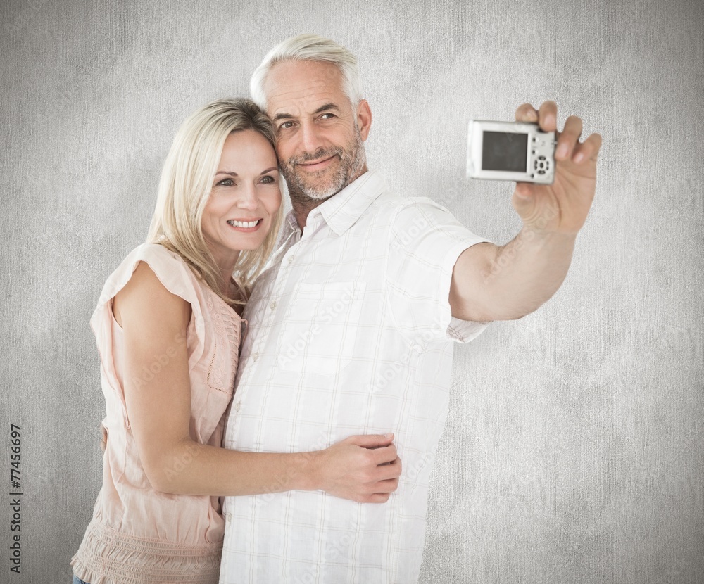 Poster composite image of happy couple posing for a selfie