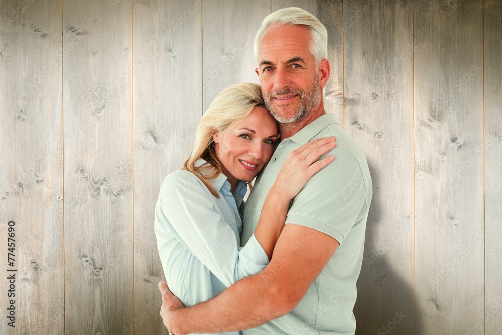 Poster composite image of happy couple standing and smiling at camera