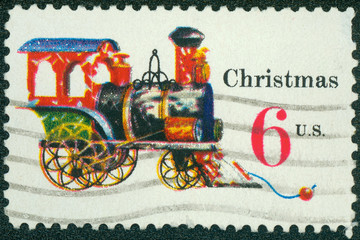 stamp printed in the USA shows Tin and Cast-iron Locomotive, Toy