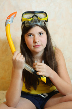 preteen beautiful girl with snorkeling mask and tube