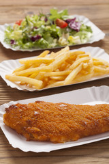 Fried fish and chips on a paper tray