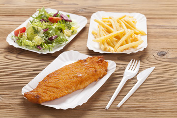 Fried fish and chips on a paper tray