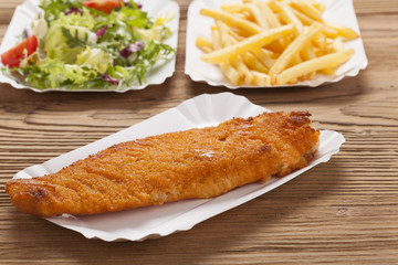 Fried fish and chips on a paper tray