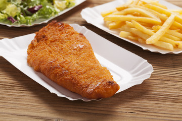 Fried fish and chips on a paper tray