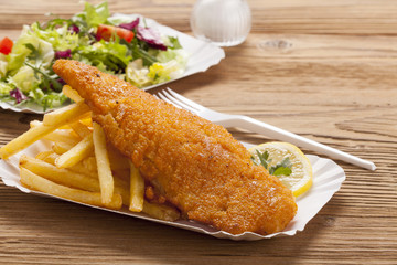 Fried fish and chips on a paper tray