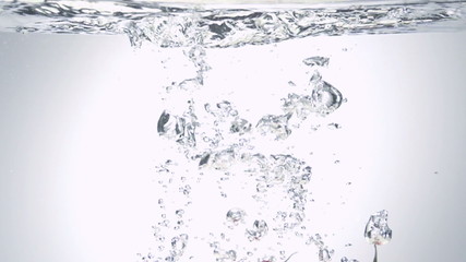 apple splashing into water on blue background - Powered by Adobe