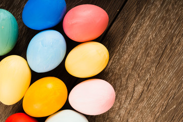 Easter eggs on wooden table background with copy space