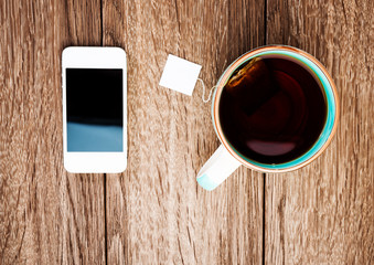 Cup of tea and phone in office