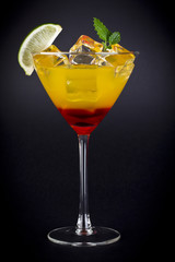 a red cocktail with orange