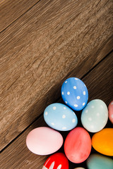 Easter eggs on wooden table background with copy space