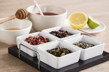 a cup of green tea, and lemon,lime, hone