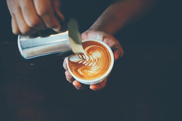 cup of coffee latte art in coffee shop - obrazy, fototapety, plakaty