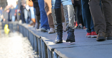 People walking on the catwalk in Venice Italy